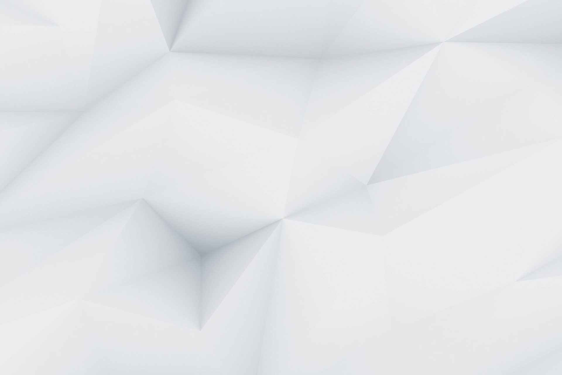 Abstract geometric background with subtle shades of white and gray, featuring three-dimensional, triangular shapes creating a faceted, origami-like texture across the entire image.