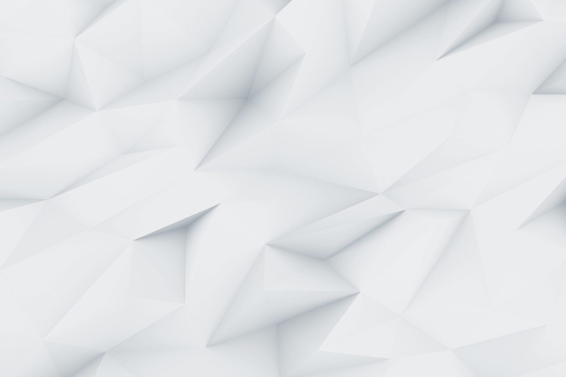 Abstract geometric background with a pattern of light gray, three-dimensional triangular facets, creating a faceted, low-poly texture with soft shadows and highlights.