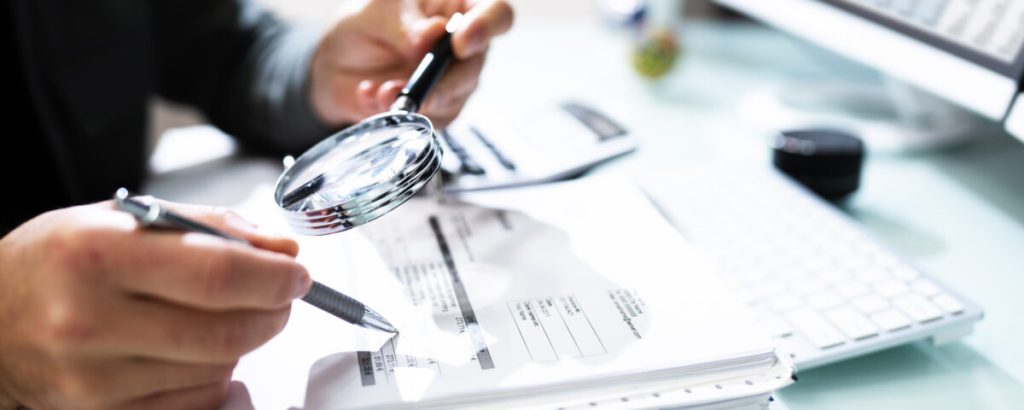 Professional reviewing cash flow statement errors during financial statement preparation